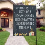 A sign that has three wise men with camels, a barn and Christmas Star says: REJOICE IN THE BIRTH OF A BROWN-SKINNED MIDDLE-EASTERN,-UNDOCUMENTED IMMIGRANT.