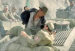 Indiana Jones punches a nazi.