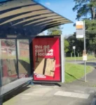 Phisical ad on bus stop with text "this ad can't be blocked". Lower part is obscured with cardboard ductaped to it.