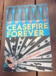 Poster on a wall featuring bombs and the words "Ceasefire Forever"