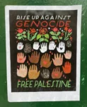 Poster on a wall featuring bleeding hands, flowers and the words "Rise up against genocide. Free Palestine"