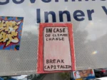 Sticker on a sign that says "In case of climate change, break capitalism". In Sydney.